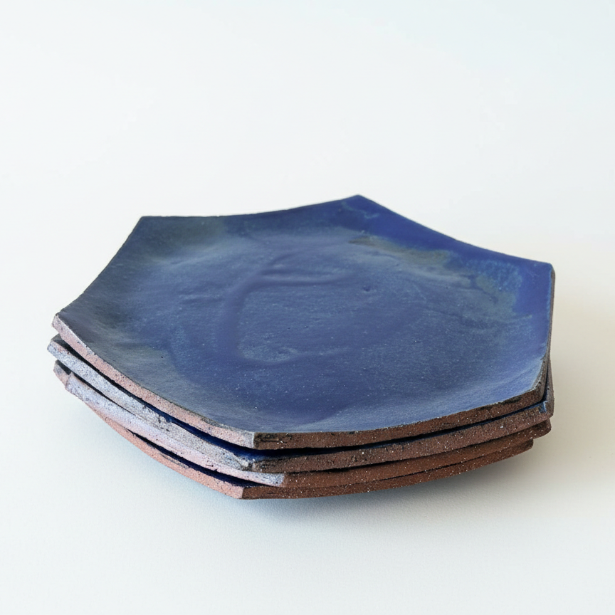 Set of blue ceramic plates on a white background