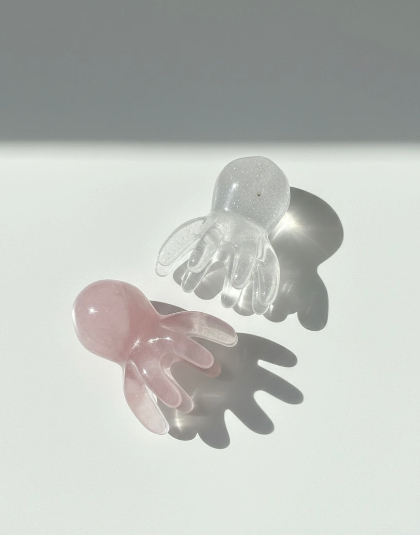 Two clear massage on a light gray background